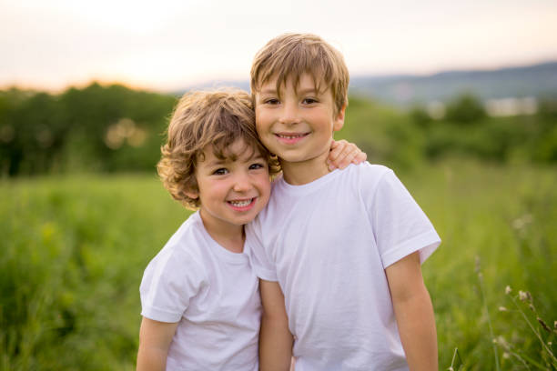 istock Brother play together in a green meadow 845712700