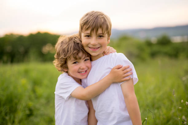 istock Brother play together in a green meadow 845712724