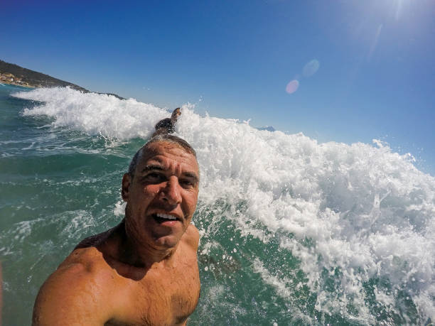 istock Happy Man In Big Sea Wave 845715588