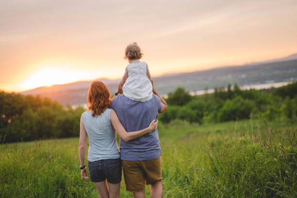 young father and mother with their cute daughter