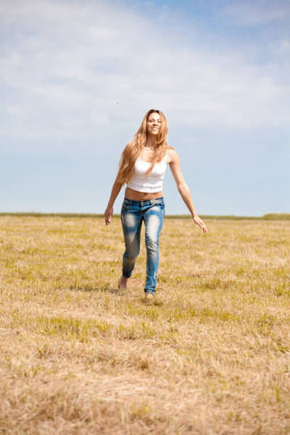 istock Happy girl on summer meadow 845719488