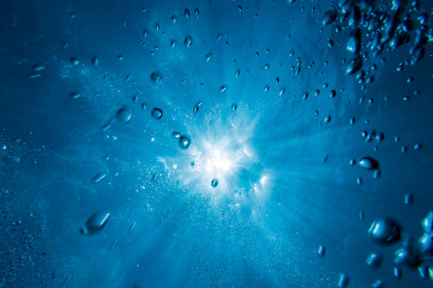 Bublles and sunburst in clear turquoise water
