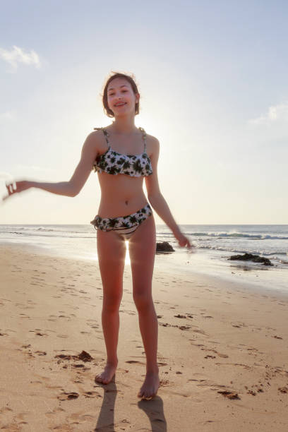 istock Playfull younf girl at the beach 845735556