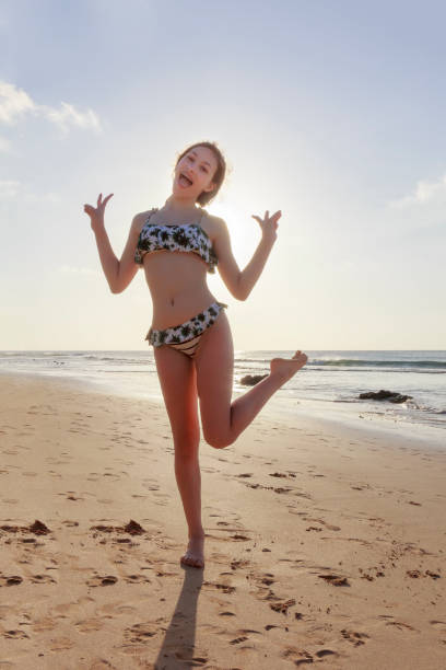istock Playfull younf girl at the beach 845735576