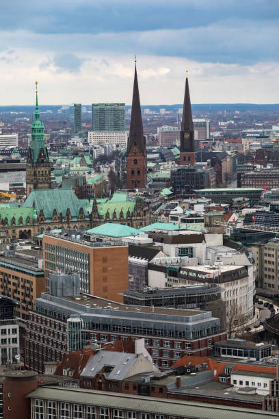 Aerial View of Hamburg, Germany. Hamburg is the second largest city in Germany and the eighth largest city in the European Union. On the river Elbe, Hamburg is a major port and a global service, media, logistics and industrial hub, with headquarters and facilities of Airbus, Blohm + Voss, Aurubis, Beiersdorf and Unilever.