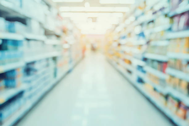 istock Empty Supermarket Aisle and Shelves in blur background 845739210