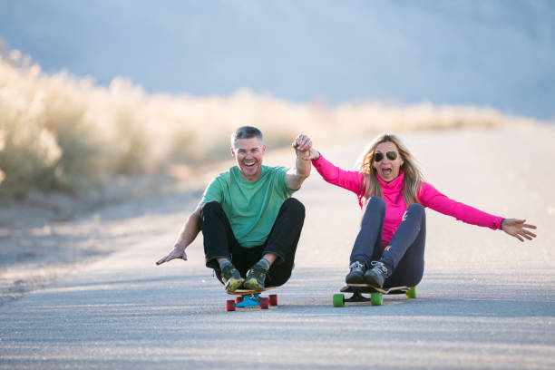 istock Happy couple on skateboard 845739950