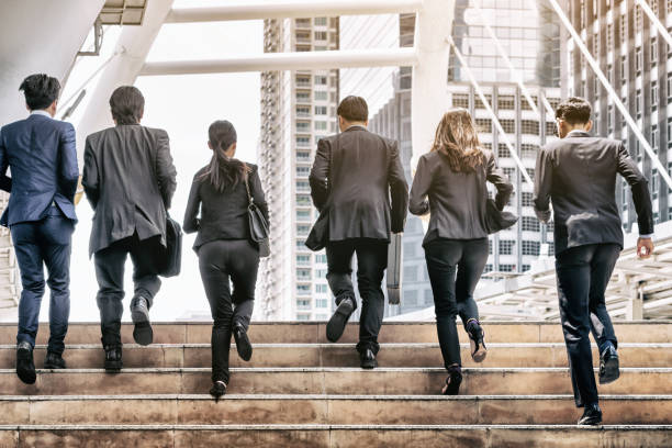 istock Group of Business People Running in Row 845740014