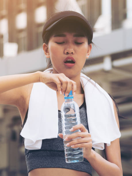 istock Sport woman with drinking water bottle 845740038