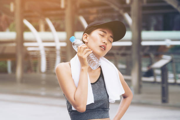 istock Sport woman with drinking water bottle 845740052