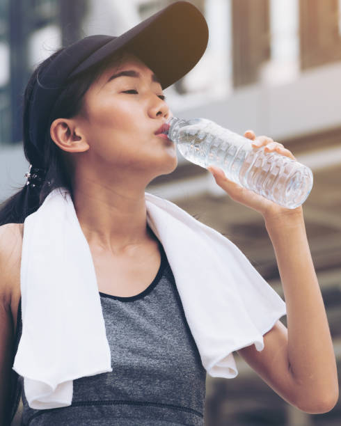 istock Sport woman with drinking water bottle 845740068