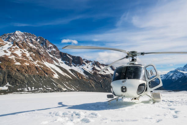 Helicopter Landing on a Snow Mountain