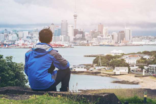 istock Young man looking Auckland city skyline 845742926