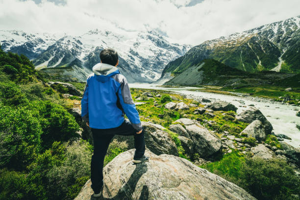istock Man traveling in mountain ranges landscape 845742938