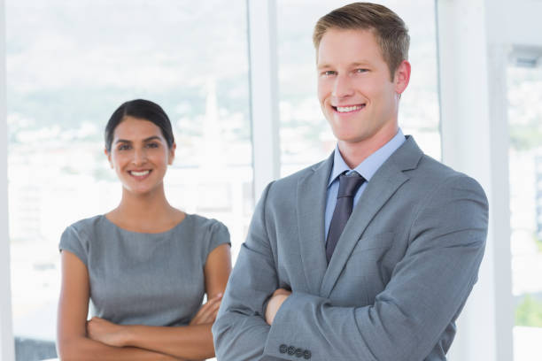 istock Smiling business colleagues smiling at camera 845748650
