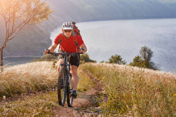 istock Adventure mountain biking on riverside 845748854