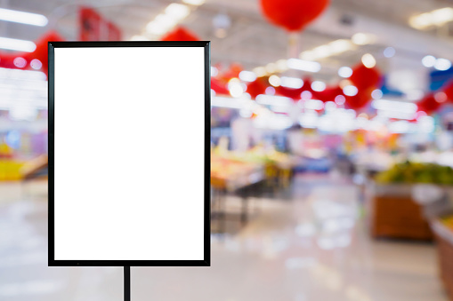 Blank price board with Supermarket store abstract blur background with bokeh