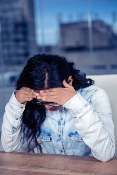 istock Troubled Asian woman with hands on face 845754140