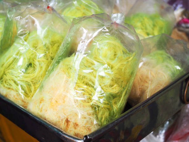 istock White green cotton candy in plastic bag stacking in aluminum tray 845754186