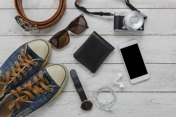 istock Above view of necessary items travel and technology background concept.Important accessory for travel and teenage or adult.Mix several objects on modern rustic white wooden home office desk. 845754298