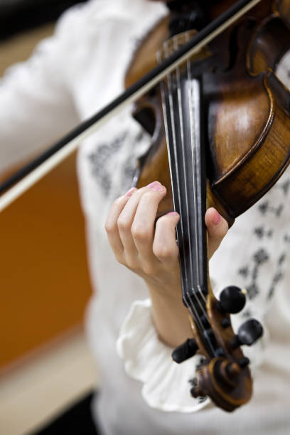 istock Hand girl playing the violin 845755096