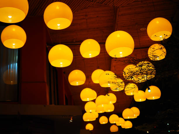 istock Orange dome glass hanging lamp group, perspective 845757344
