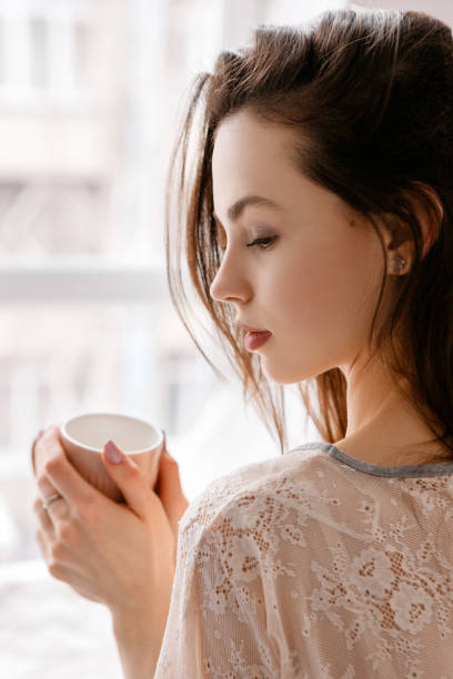 istock Sensual young woman with cup of coffee 845757798