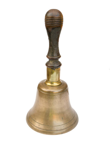 istock Old brass school bell, isolated on white. 845757884