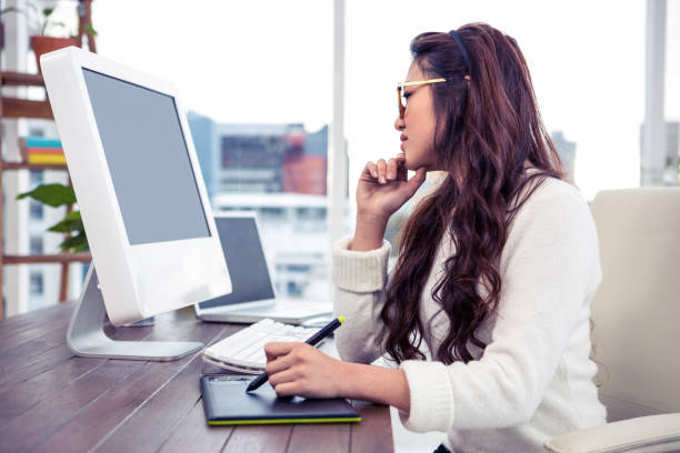 istock Asian woman using digital board and looking at computer monitor 845760658
