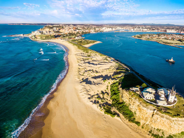 Nobbys Lighthouse overlooking Newcastle, Australia Aerial shot of Nobbys Lighthouse overlooking Newcastle, Australia newcastle new south wales photos stock pictures, royalty-free photos & images