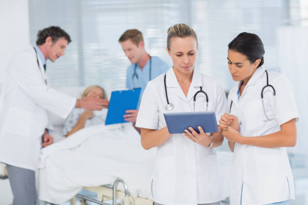 istock Doctors looking at clipboard while theirs colleagues speaks with patient 845775272