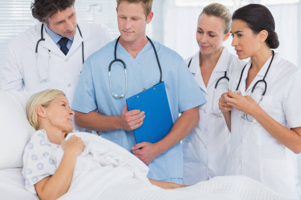 istock Team of doctors speaking to their patient 845775284
