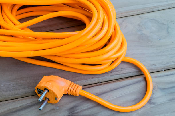 оранжевый электрический удлинитель - extension cord стоковые фото и изображения