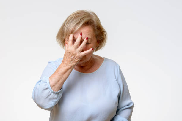istock Senior woman covering her face with her hand 845781704