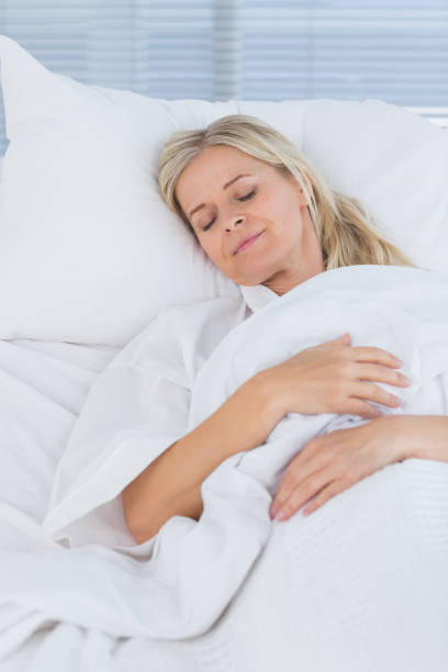 istock Happy patient lying on her bed 845781928