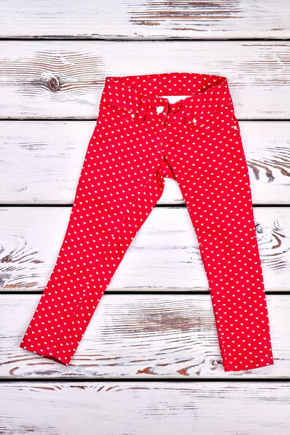 istock Girl red patterned cotton trousers. 845782590