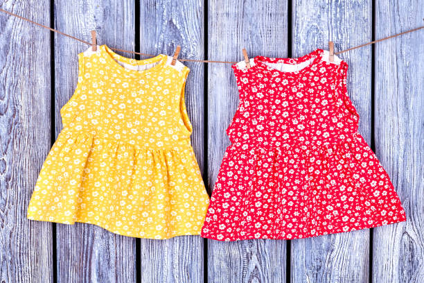 istock Kids dresses hanging on rope. 845785996