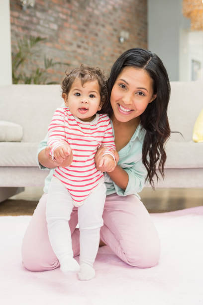 istock Mother with baby learning to walk 845790062