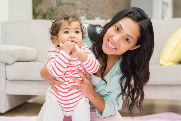 istock Mother with baby learning to walk 845790102