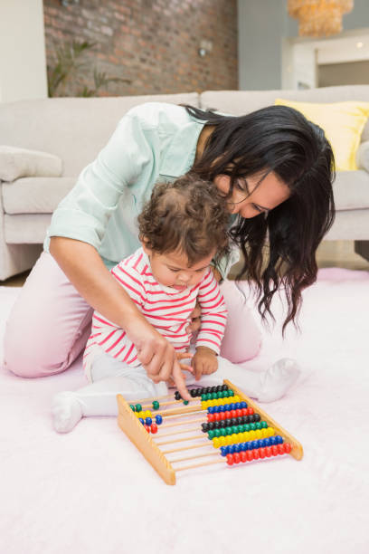 istock Mother and baby playing with abacus 845790122