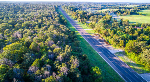 Bastrop , Texas Forest Aerial Drone bird's eye view long perspective long open road
