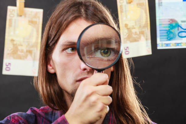 istock Man verify money cash 845796196
