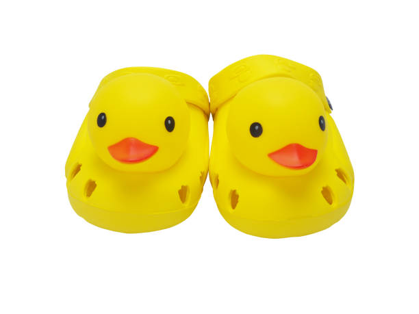 kid's yellow duck shoes isolate on white background