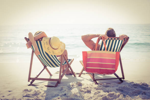 istock Couple relaxing on the beach 845800066