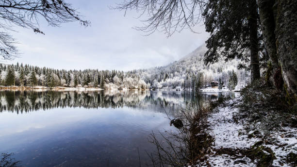 istock first snow at the mountain lake 845800286