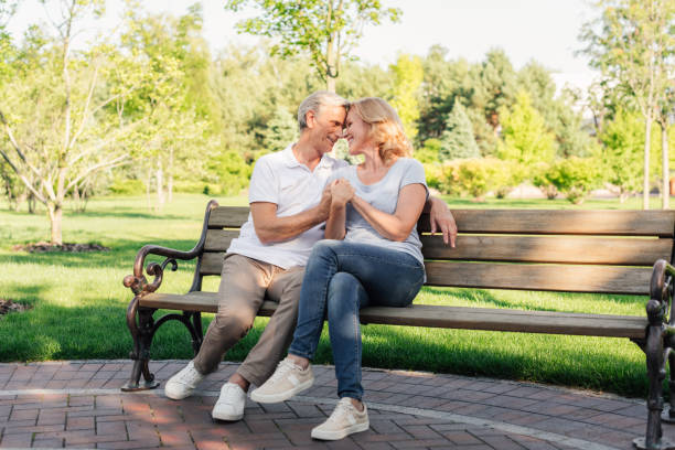 istock senior couple in park 845800360