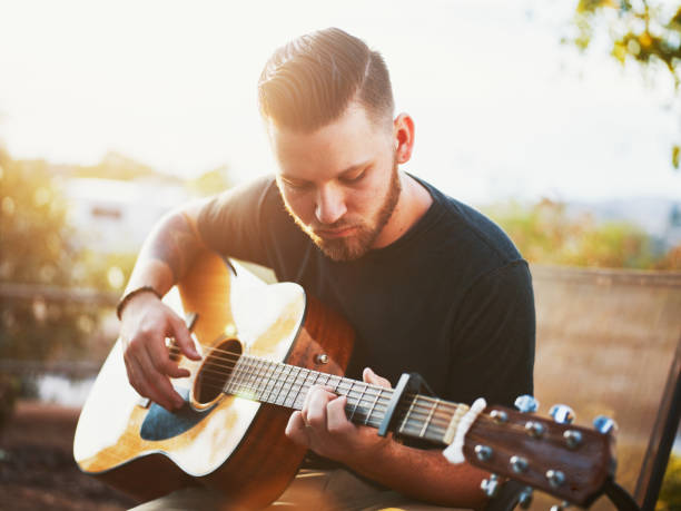 istock Young man playing Acoustic guitar 845806088