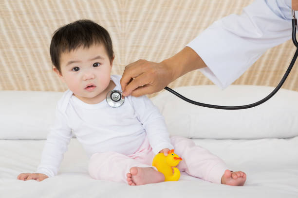 istock Cute baby being visited by doctor 845809768