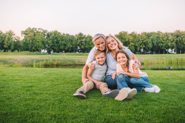 istock family resting on meadow 845813398