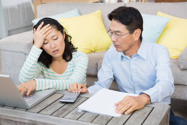 istock Worried couple checking bills 845816960